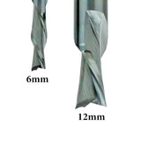 Close-up of two spiral carbide router bits, 6mm and 12mm sizes for woodworking.