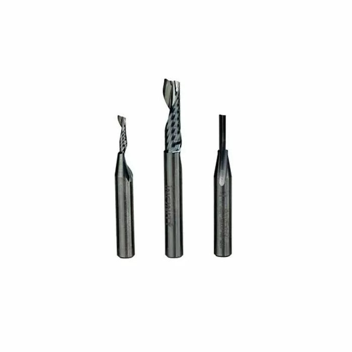 Set of three carbide router bits for woodworking on white background