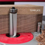 Template flush trim router bit cutting wood on a router table, woodworking setup shown.