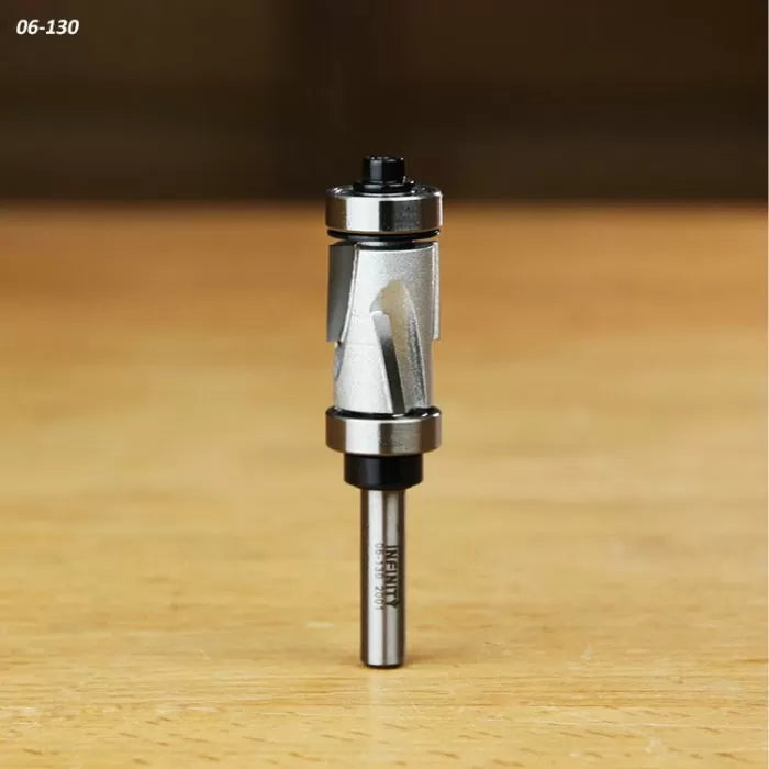 Carbide flush trim router bit with dual bearing, shown upright on wood surface