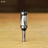 Carbide flush trim router bit with dual bearing, shown upright on wood surface