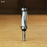Flush trim router bit with dual bearings on a wooden surface, woodworking tool close-up