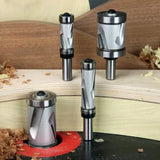 Set of carbide spiral flush trim router bits on woodwork backdrop with wood shavings