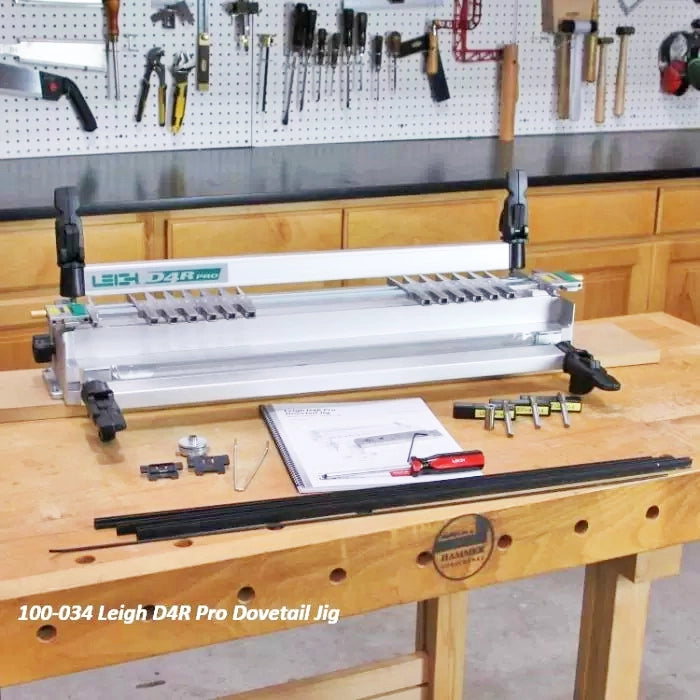 Leigh D4R Pro dovetail jig with accessories on workbench in woodshop, woodworking tool