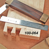 Dovetail joint woodworking with steel ruler and marking gauge on wood board