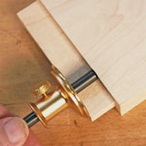Brass marking gauge tool measuring wood for precise woodworking layout