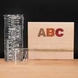 Acrylic letter templates and wooden box with ABC inlaid, woodworking tool set on table