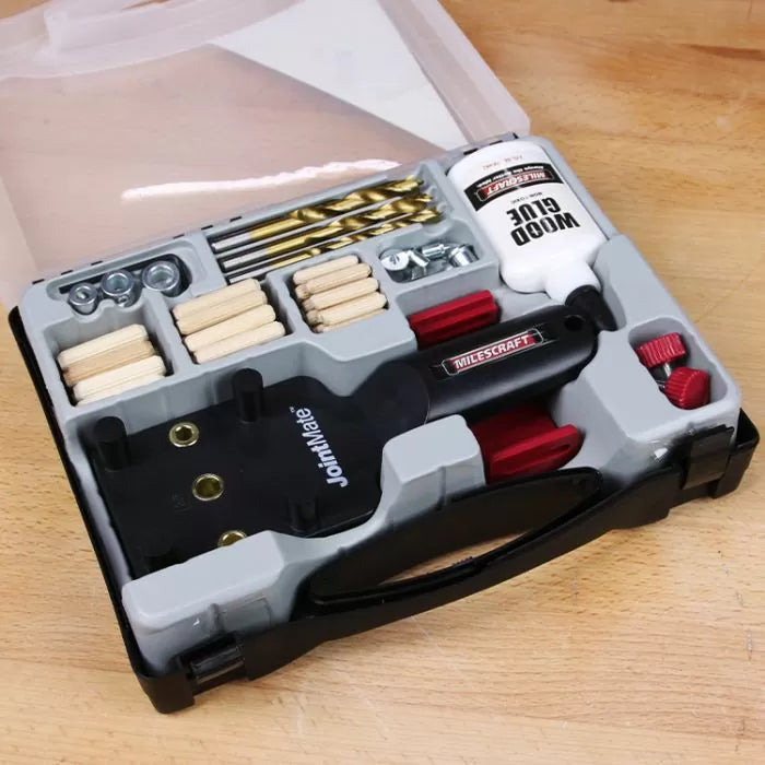 Woodworking doweling jig kit with drill bits, wood glue, dowels, and hardware in a case