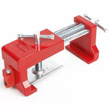 Red corner clamp for woodworking with metal screw handles on a white background