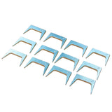 Set of twelve metal pinch dogs for woodworking on a white background