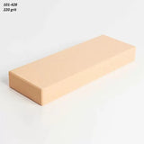Rectangular 220 grit sharpening stone on white background, ideal for woodworking tools.