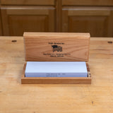 3000 grit waterstone sharpening stone in wooden box on workbench
