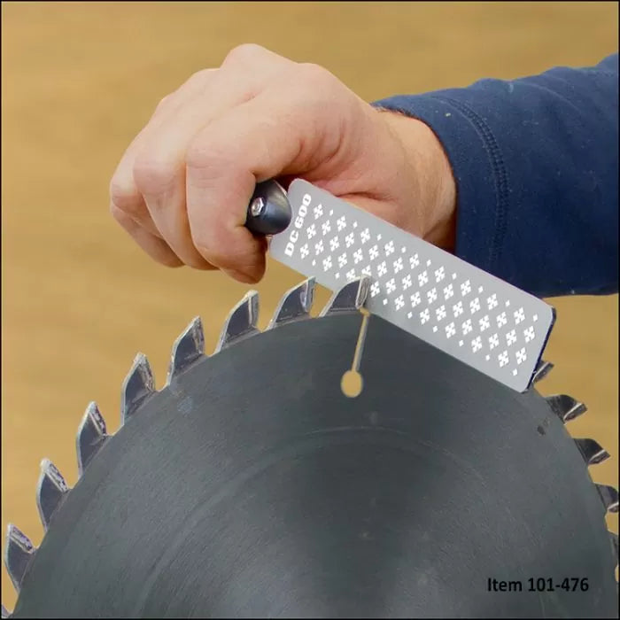Hand sharpening circular saw blade with a diamond file tool for woodworking precision