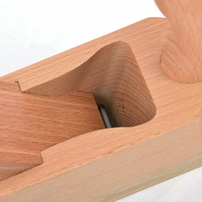 Close-up of a wooden hand plane for woodworking with exposed blade and smooth beech body.