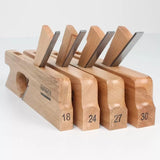 Set of four wooden woodworking hand planes with blades, numbered 18, 24, 27, 30
