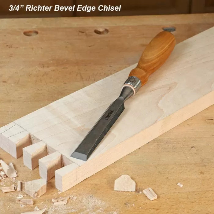 3/4 inch bevel edge chisel with wooden handle on a dovetailed wood board