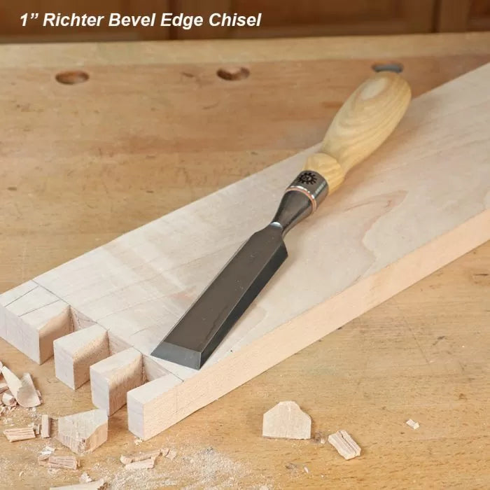 1 inch bevel edge chisel on a wooden workbench with dovetail joints and wood shavings