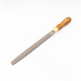 Woodworking hand rasp with wooden handle and textured steel file on white background