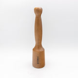 Wood carver's mallet with smooth handle and engraved logo on white background