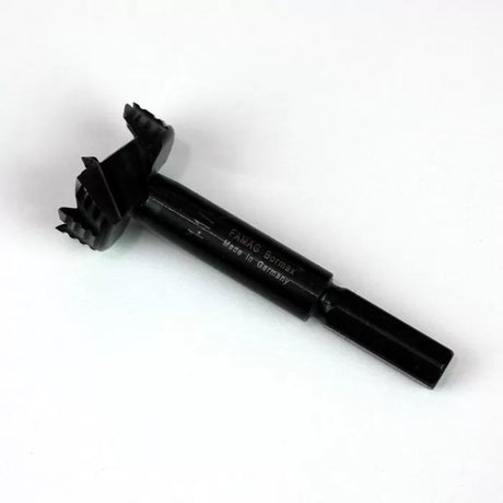 Black Forstner drill bit for woodworking on white background