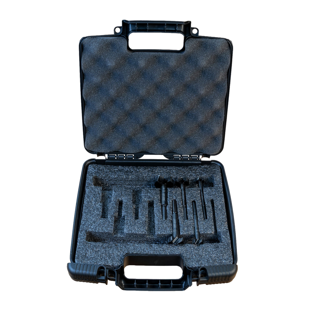 Black hard-shell carrying case with foam interior with Famag forstner bits on a white background