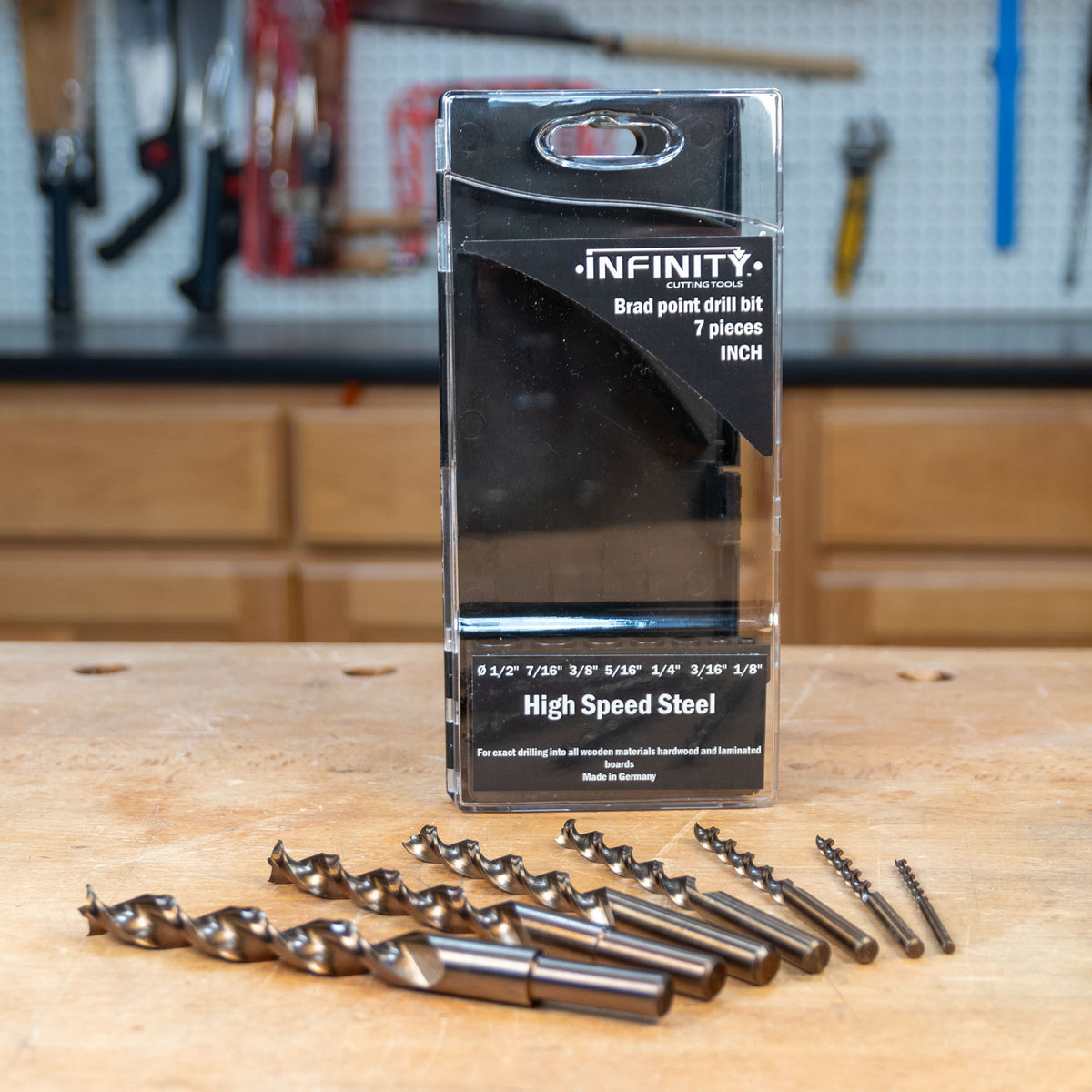 High speed steel brad point drill bit set with case on a woodworking bench