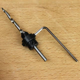 Drill bit with adjustable stop collar and hex key on wooden surface, woodworking tool