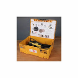 Electric orbital sander in yellow storage case on wood workbench, woodworking tool kit