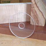 Clear acrylic circle woodworking template on wood boards, ideal for routing projects