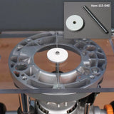 Router table centering pin and alignment disk kit installed on a router base, woodworking accessory.