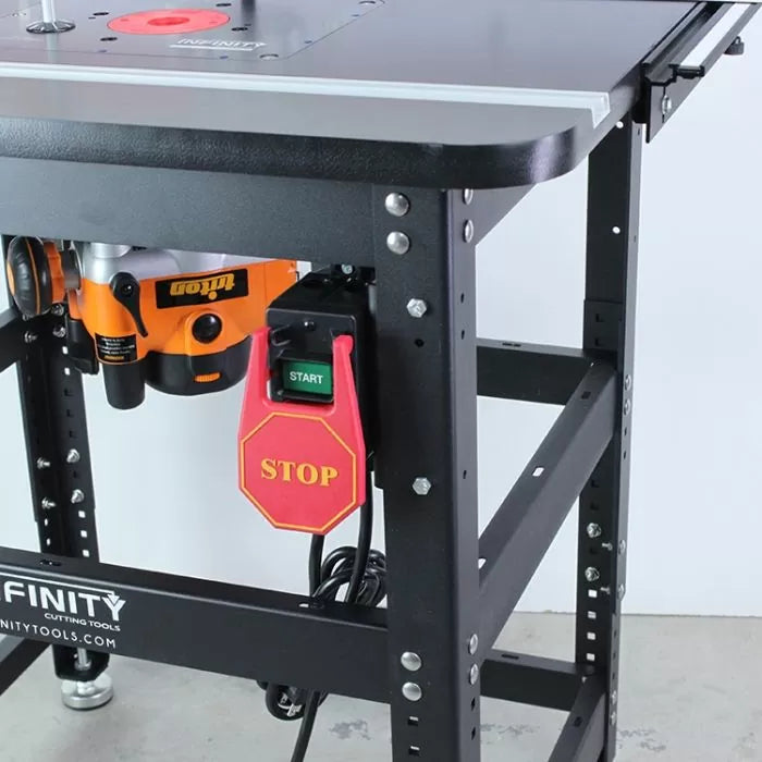 Router table stand with mounted router, power switch, and sturdy steel frame