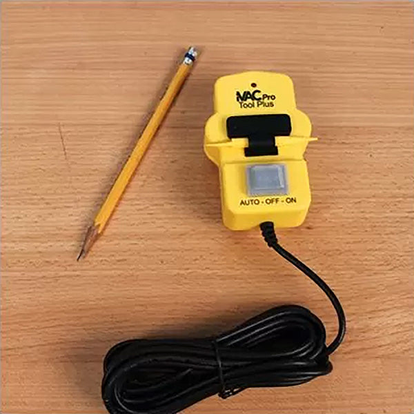Yellow VAC Pro Tool Plus power switch with cable and pencil on wood surface, woodworking accessory