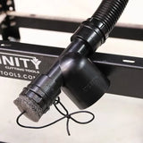 Dust collection hose adapter for woodworking tools attached to a metal table frame