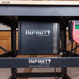 Dust collection box installed under a woodworking router table in a workshop