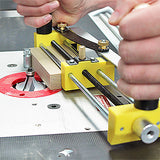 Woodworking router table with push block jig guiding wood for precise cutting