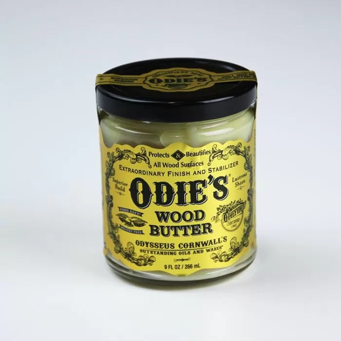 Odie's Wood Butter jar for wood finish and protection, yellow label, black lid, 9 fl oz