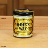 Odie's Wax jar for wood finishing on a wooden table, woodworking supplies.
