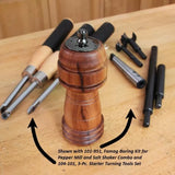 Wood pepper mill on workbench with woodturning tools and boring kit for pepper mill making.