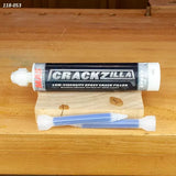 CrackZilla low-viscosity epoxy crack filler tube on wood surface with nozzles for woodworking repairs