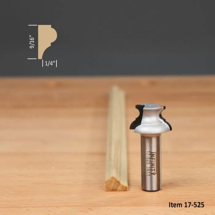 Classical ogee router bit with molding profile and sample wood trim on workbench