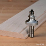Roundover router bit on wood plank for woodworking and precise edge profiling