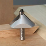Chamfer router bit with bearing on wood surface for precise woodworking cuts
