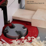 Mega Dado and Planer router bit cutting groove in wood with wood shavings on router table