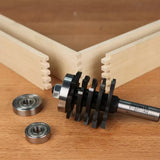 Router bit set and bearings for box joint woodworking on wooden table with jointed boards