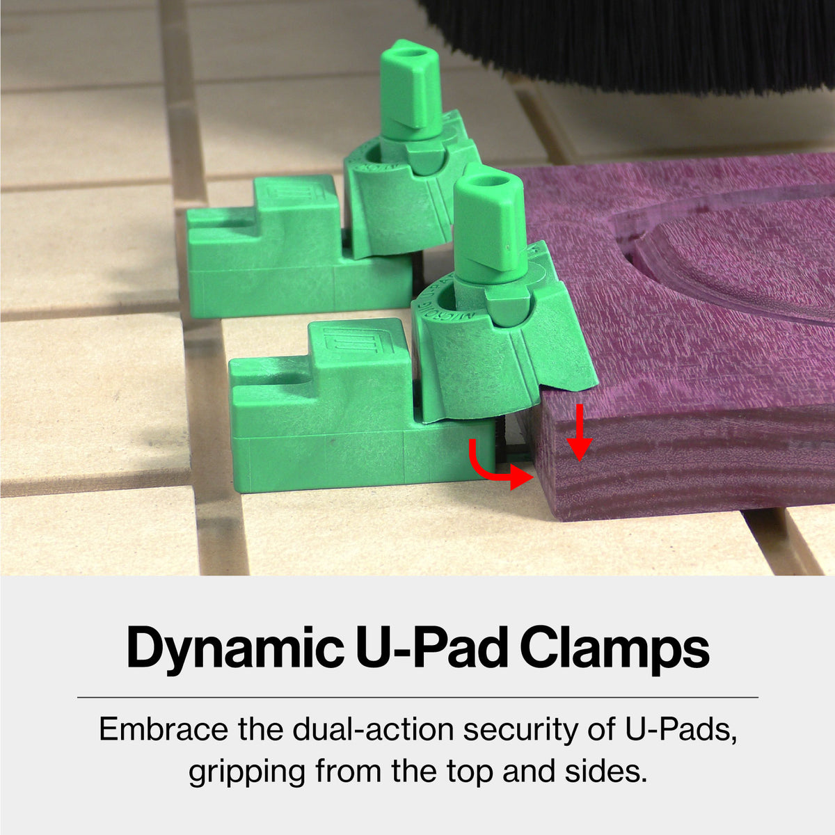 Green CNC U-Pad clamps securing a purple wood board on a workbench for woodworking.