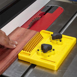 Table saw featherboard holding wood against fence for safe, precise woodworking cut
