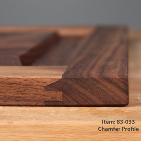 Close-up of a chamfered wooden profile joint showing the joint profile and wood grain, with text in the bottom right corner reading 'Item: 83-033 Chamfer Profile'.