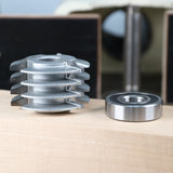 Stacked dado blades and a bearing for woodworking on a wooden surface