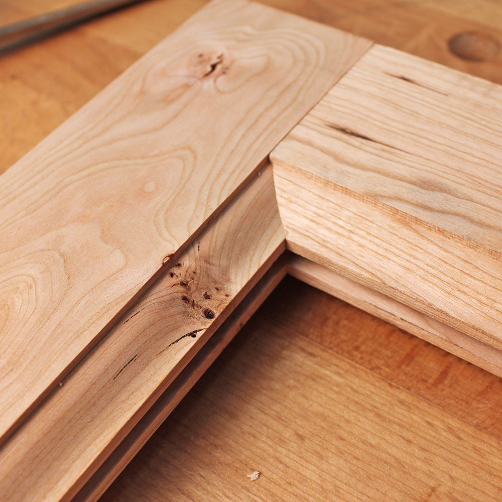 Close-up of mitered rabbet joint in unfinished hardwood for woodworking projects