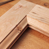 Close-up of mitered rabbet joint in unfinished hardwood for woodworking projects